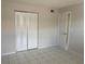 Bedroom featuring tile floors, neutral walls and a closet at 709 Michigan Ct # 4, St Cloud, FL 34769