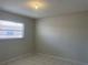 Bedroom featuring tile floors, neutral walls and a bright window at 709 Michigan Ct # 4, St Cloud, FL 34769