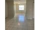 An interior view showcasing the kitchen with white appliances and tile floors at 709 Michigan Ct # 4, St Cloud, FL 34769