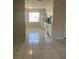 An interior view of the kitchen with white appliances and tile floors at 709 Michigan Ct # 4, St Cloud, FL 34769