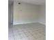 Spacious living room with tile floors and neutral paint at 709 Michigan Ct # 4, St Cloud, FL 34769