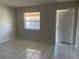 Open living room space with neutral walls and tile flooring at 709 Michigan Ct # 4, St Cloud, FL 34769