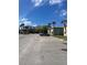 Wide shot of an apartment building with a parking lot and a single car at 709 Michigan Ct # 4, St Cloud, FL 34769