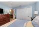 Bedroom with closet space, ceiling fan, dresser, and access to an en-suite at 8121 Deville Ct, Orlando, FL 32817