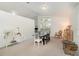 Inviting dining area with a large window, neutral color palette, and stylish decor at 8121 Deville Ct, Orlando, FL 32817