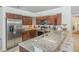 Modern kitchen with stainless steel appliances, granite countertops, and wooden cabinetry at 8121 Deville Ct, Orlando, FL 32817