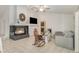 Cozy living room featuring a fireplace, plush seating, and a neutral color scheme at 8121 Deville Ct, Orlando, FL 32817