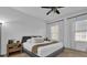 This bedroom features a Queen-size bed, carpet flooring, and a ceiling fan at 1012 Parma Cir, Lake Mary, FL 32746