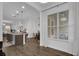 Open-concept layout features an island, modern lighting, and hardwood floors at 1012 Parma Cir, Lake Mary, FL 32746