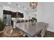 Open concept view of kitchen island with stainless steel appliances and breakfast bar seating at 1012 Parma Cir, Lake Mary, FL 32746