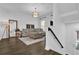 Bright living room features hardwood floors, a plush sofa, and elegant decor at 1012 Parma Cir, Lake Mary, FL 32746