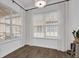Bright room features hardwood floors, large windows with blinds and modern accents at 1012 Parma Cir, Lake Mary, FL 32746