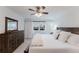Calming bedroom with wooden furniture, plush bedding, and natural light at 1109 Clubside Dr # 1109, Longwood, FL 32779