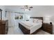 Serene bedroom features wood furnishings, soft lighting, and neutral decor at 1109 Clubside Dr # 1109, Longwood, FL 32779