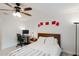 Bedroom featuring white walls, a ceiling fan, a desk, and a window with curtains allowing natural light at 1109 Clubside Dr # 1109, Longwood, FL 32779