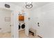 Bright entryway with white walls, travertine floors, and a laundry room at 1109 Clubside Dr # 1109, Longwood, FL 32779