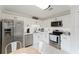 Well-lit kitchen with stainless steel appliances, ample white cabinetry, and stylish decor at 1109 Clubside Dr # 1109, Longwood, FL 32779