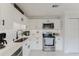Updated kitchen with white cabinets, stainless appliances, and sleek countertops at 1109 Clubside Dr # 1109, Longwood, FL 32779