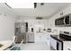 Modern kitchen features stainless steel appliances, white cabinetry, and subway tile backsplash at 1109 Clubside Dr # 1109, Longwood, FL 32779