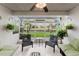 Cozy screened-in patio featuring outdoor seating, decorative plants, and backyard view at 1109 Clubside Dr # 1109, Longwood, FL 32779