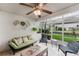 Relaxing covered patio with comfortable seating, decorative accents, and serene backyard views at 1109 Clubside Dr # 1109, Longwood, FL 32779