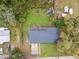 Bird's eye view of the home featuring a well-maintained roof, green lawn, and perimeter fence at 1126 Turner Ln, Altamonte Springs, FL 32714