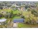 Aerial shot of the house showing the expansive green backyard, mature trees, and peaceful surroundings at 1126 Turner Ln, Altamonte Springs, FL 32714