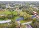Aerial view of the property showcasing a spacious yard, mature trees, and a peaceful residential area at 1126 Turner Ln, Altamonte Springs, FL 32714