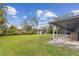 Expansive backyard with covered patio, lush lawn and a storage shed at 1126 Turner Ln, Altamonte Springs, FL 32714