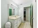 This bathroom has a light green wall and features a large mirror at 1126 Turner Ln, Altamonte Springs, FL 32714