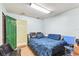 This bedroom has a blue comforter and wood-look floors at 1126 Turner Ln, Altamonte Springs, FL 32714