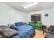 This cozy bedroom features light blue walls and a large screen television at 1126 Turner Ln, Altamonte Springs, FL 32714
