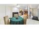 Open-concept dining area adjacent to kitchen with modern lighting and fireplace at 1126 Turner Ln, Altamonte Springs, FL 32714
