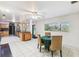 Open-concept dining area adjacent to the kitchen with modern lighting, bright white walls and tiled flooring at 1126 Turner Ln, Altamonte Springs, FL 32714