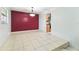 Dining room area with tiled floors and red accent wall at 1126 Turner Ln, Altamonte Springs, FL 32714