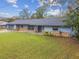 Charming single-story home with stone accents, well-manicured lawn, and attached two car garage at 1126 Turner Ln, Altamonte Springs, FL 32714