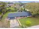 Aerial shot of charming single-story house with brick accents, mature lawn, and attached garage at 1126 Turner Ln, Altamonte Springs, FL 32714