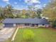 Charming ranch-style house with a well-manicured lawn, brick accents, and an attached garage at 1126 Turner Ln, Altamonte Springs, FL 32714