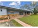 Lovely single story home with stone accents and a red tile walkway to the front door at 1126 Turner Ln, Altamonte Springs, FL 32714