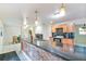 Spacious kitchen with granite countertops, brick island, wood cabinets, and stainless appliances at 1126 Turner Ln, Altamonte Springs, FL 32714