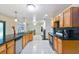 Bright kitchen featuring granite countertops, wood cabinetry, and stainless steel appliances at 1126 Turner Ln, Altamonte Springs, FL 32714
