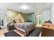 Bedroom featuring unique painted walls and wood laminate flooring at 1126 Turner Ln, Altamonte Springs, FL 32714