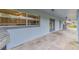 A covered patio runs the length of the back of this house, with views of the back yard at 1126 Turner Ln, Altamonte Springs, FL 32714