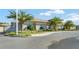 Exterior view of a well-maintained building with manicured landscaping and a modern design at 1205 Bella Rose Ct, Davenport, FL 33896