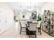 Charming dining area adjacent to the kitchen with modern lighting and decor at 1284 Pavia Dr, Apopka, FL 32703