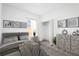 Nicely decorated bedroom with gray wood floors, closet, and modern furniture at 13163 Sw 70Th Ct, Ocala, FL 34473