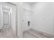 View of laundry room with hookups, wire shelving, and luxury vinyl plank flooring at 13163 Sw 70Th Ct, Ocala, FL 34473