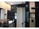 Modern bathroom with black marble walls, a glass-enclosed shower, and contemporary fixtures for a spa-like experience at 13413 Hopkinton Ct, Windermere, FL 34786