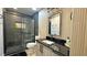Modern bathroom featuring a walk-in shower, and black hardware at 13413 Hopkinton Ct, Windermere, FL 34786