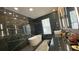 Sleek bathroom boasts black marble walls, modern fixtures, and a luxurious soaking tub at 13413 Hopkinton Ct, Windermere, FL 34786